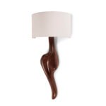 sculptural solid wood wall lighting illuminated in modern interior
