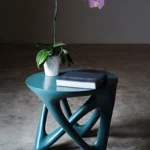 modern sculptural solid wood side table from angled perspective