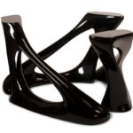 modern sculptural solid wood dining table from angled perspective