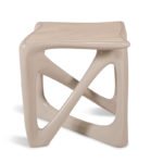 modern sculptural solid wood side table from angled perspective