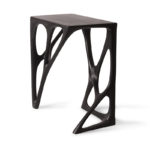 sculptural solid wood base detail of Ariel table