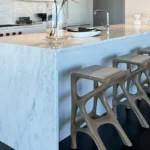 Sculptural solid wood stool in interior design space