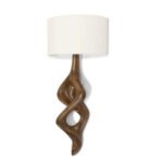 sculptural solid wood wall lighting sconce illuminated in modern interior