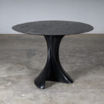 sculptural wood table in interior setting Dervish by Amorph