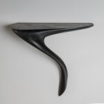 architectural profile of sculptural solid wood wall mounted console table