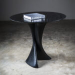 architectural profile of sculptural solid wood center table