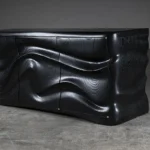 sculptural solid wood base detail of Xena cabinet