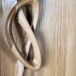 hand carved wood surface detail of sculptural interior door Flow by Amorph