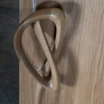 organic sculptural form detail of solid wood interior door Flow by Amorph