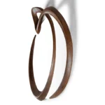 side view of sculptural wood wall mirror Saba by Amorph
