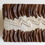 sculptural solid wood modern wall mounted cabinet collection by Amorph