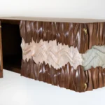hand finished detail of sculptural wood wall mounted cabinet Novia by Amorph