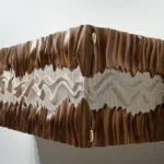 sculptural solid wood Novia wall mounted cabinet by Amorph
