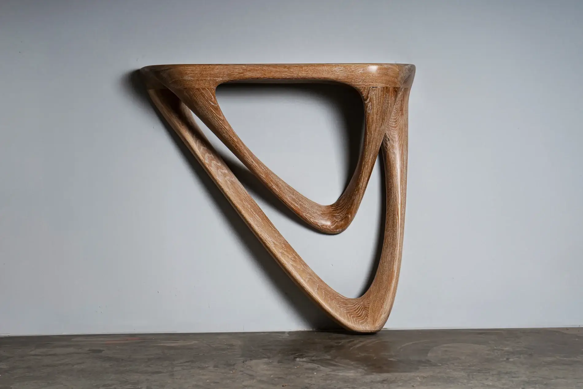 sculptural solid wood wall mounted console table Aras by Amorph