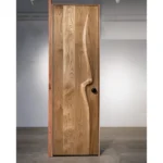 Sculptural solid wood interior door handcrafted in Los Angeles by Amorph Studio