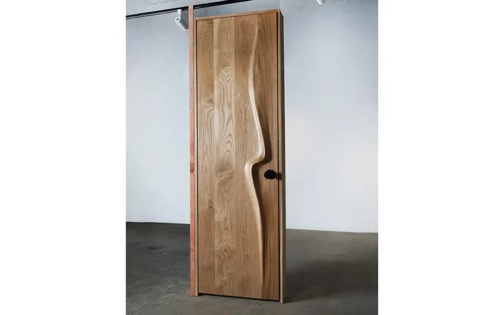 Sculptural solid wood interior door handcrafted in Los Angeles by Amorph Studio