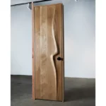 Sculptural solid wood interior door handcrafted in Los Angeles by Amorph Studio
