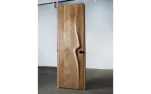Sculptural solid wood interior door handcrafted in Los Angeles by Amorph Studio