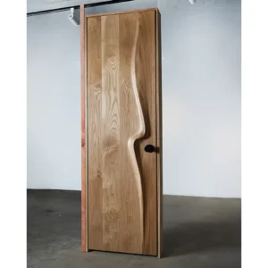 Sculptural solid wood interior door handcrafted in Los Angeles by Amorph Studio