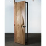 Sculptural solid wood interior door handcrafted in Los Angeles by Amorph Studio